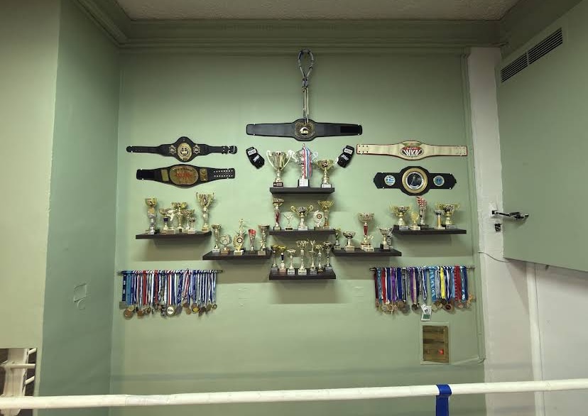 Inside Kallistis Fight Academy — championship belts and trophies